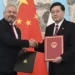 Honduras Foreign Minister, Eduardo Enrique Reina Garcia, left, and Chinese Foreign Minister, Qin Gang shake hands following the establishment of diplomatic relations between the two countries, at a ceremony in the Diaoyutai State Guesthouse in Beijing Sunday, March 26, 2023.