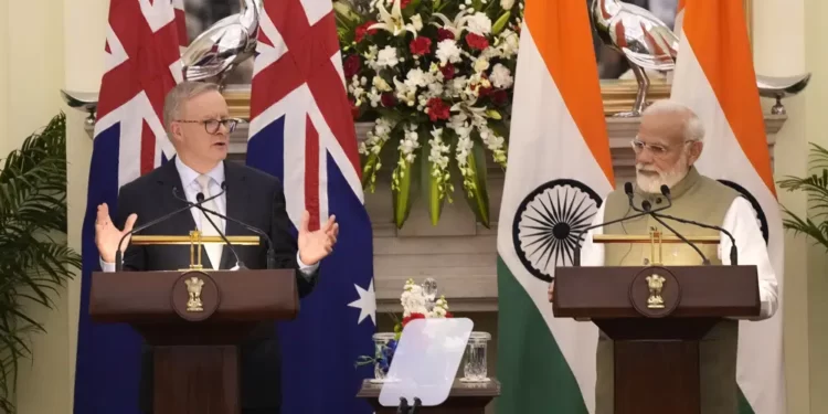 Indian Prime Minister Narendra Modi watches as his Australian counterpart Anthony Albanese makes a press statement, in New Delhi, India, Friday, March 10, 2023.