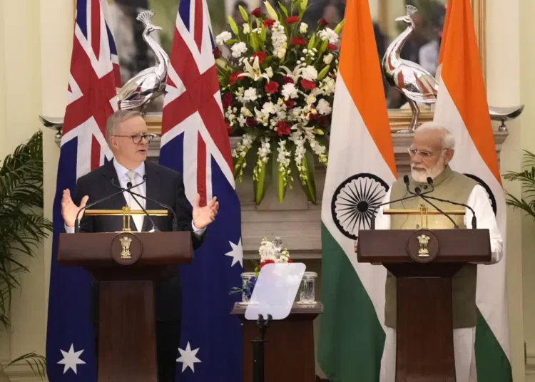 Australia, India Aim To Strengthen Security And Economic Ties 1 Indian Prime Minister Narendra Modi watches as his Australian counterpart Anthony Albanese makes a press statement, in New Delhi, India, Friday, March 10, 2023.