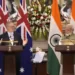 Indian Prime Minister Narendra Modi watches as his Australian counterpart Anthony Albanese makes a press statement, in New Delhi, India, Friday, March 10, 2023.
