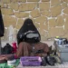 Afghanistan Is World’s Most Repressive Country For Women- UN 11 An Afghan woman cleans customers's shoes in a street in Kabul, Afghanistan