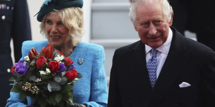 Britain's King Charles III and Camilla, the Queen Consort, arrive at the airport in Berlin, Wednesday, March 29, 2023.
