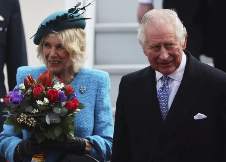 Britain's King Charles III and Camilla, the Queen Consort, arrive at the airport in Berlin, Wednesday, March 29, 2023.