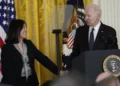 President Joe Biden talks about his nomination of Julie Su, left, to serve as the Secretary of Labor during an event in the East Room of the White House in Washington, Wednesday, March 1, 2023.