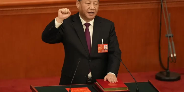 Chinese President Xi Jinping takes his oath after he is unanimously elected as President during a session of China's National People's Congress (NPC) at the Great Hall of the People in Beijing, Friday, March 10, 2023.