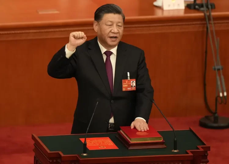 Chinese President Xi Jinping takes his oath after he is unanimously elected as President during a session of China's National People's Congress (NPC) at the Great Hall of the People in Beijing, Friday, March 10, 2023.