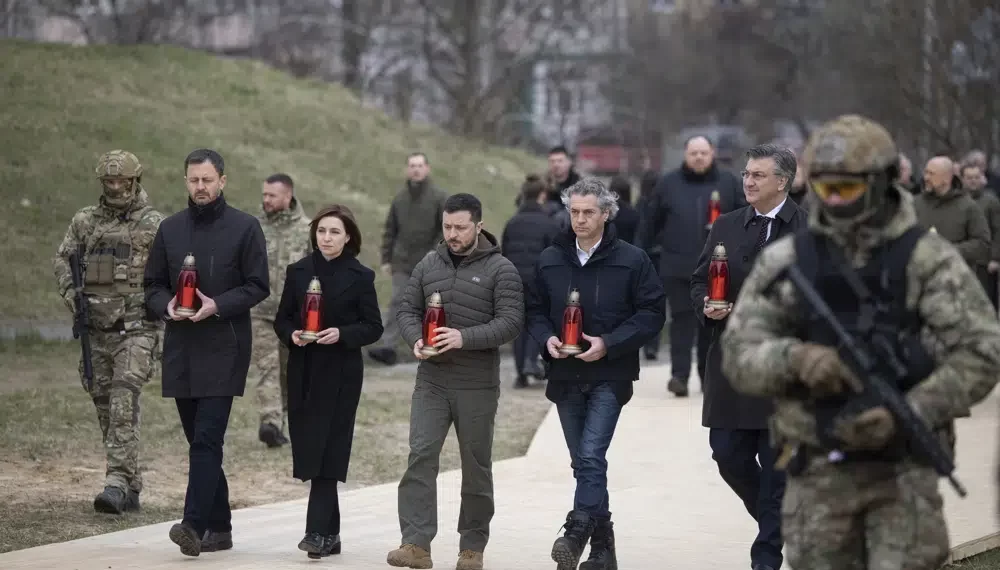 Ukraine Commemorates Anniversary Of Bucha’s Liberation 1 From second left to right, Slovakia's Prime Minister Eduard Heger, Moldova's President Maia Sandu, Ukrainian President Volodymyr Zelenskyy, Slovenia's Prime Minister Robert Golob, and Croatia's Prime Minister Andrej Plenkovic attend a commemorative event on anniversary of the liberation of the territories from the Russian troops in Bucha, on the outskirts of Kyiv, Ukraine, Friday, March 31, 2023.