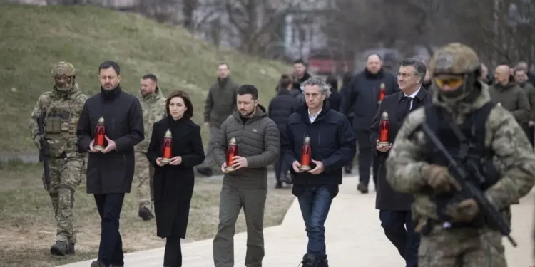 From second left to right, Slovakia's Prime Minister Eduard Heger, Moldova's President Maia Sandu, Ukrainian President Volodymyr Zelenskyy, Slovenia's Prime Minister Robert Golob, and Croatia's Prime Minister Andrej Plenkovic attend a commemorative event on anniversary of the liberation of the territories from the Russian troops in Bucha, on the outskirts of Kyiv, Ukraine, Friday, March 31, 2023.