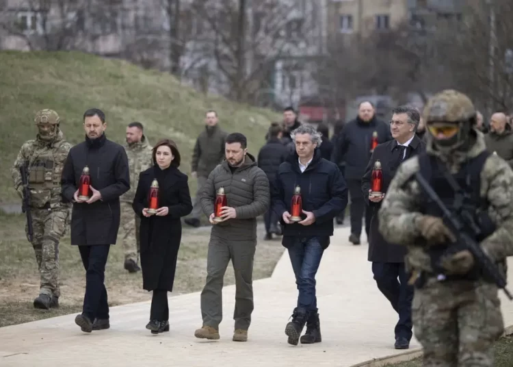 Ukraine Commemorates Anniversary Of Bucha’s Liberation 1 From second left to right, Slovakia's Prime Minister Eduard Heger, Moldova's President Maia Sandu, Ukrainian President Volodymyr Zelenskyy, Slovenia's Prime Minister Robert Golob, and Croatia's Prime Minister Andrej Plenkovic attend a commemorative event on anniversary of the liberation of the territories from the Russian troops in Bucha, on the outskirts of Kyiv, Ukraine, Friday, March 31, 2023.