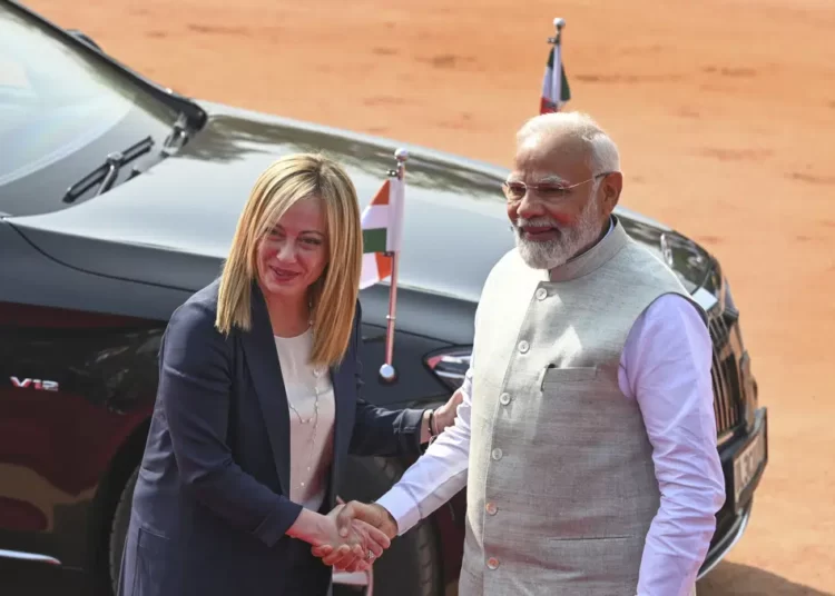 Italian Premier Giorgia Meloni, left, is received by Indian Prime Minister Narendra Modi