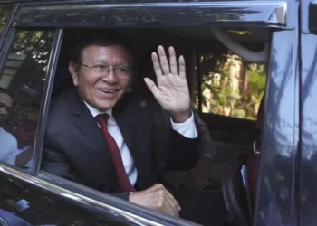 Former President of Cambodia National Rescue Party, Kem Sokha, waves from his car