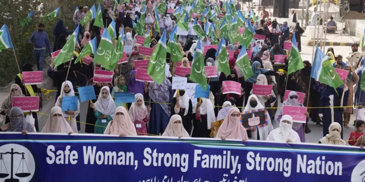 Women supporters of a religious party "Jamaat-e-Islami" participate in a rally to mark International Women's Day, in Lahore, Pakistan, Wednesday, March 8, 2023.