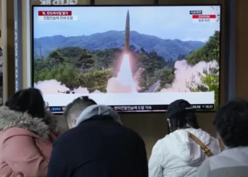 A TV screen shows a file image of North Korea's missile launch during a news program at the Seoul Railway Station in Seoul, South Korea, Tuesday, March 14, 2023.