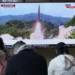 A TV screen shows a file image of North Korea's missile launch during a news program at the Seoul Railway Station in Seoul, South Korea, Tuesday, March 14, 2023.