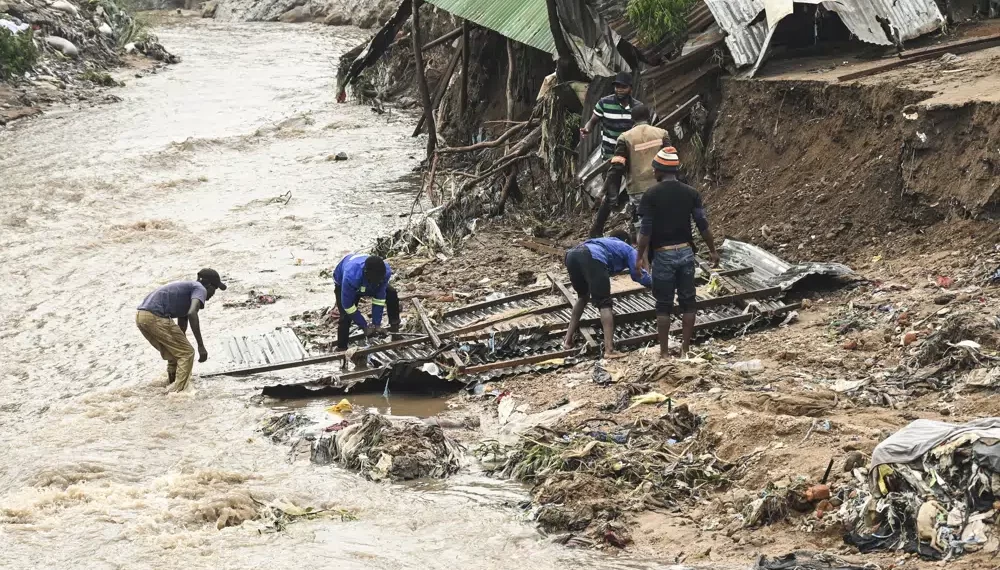 Africa’s Economies Suffer As Climate Woes Worsen- UN 1 Men salvage parts from their destroyed home, following heavy rains caused by Cyclone Freddy in Blantyre, southern Malawi, Wednesday, March 15, 2023.
