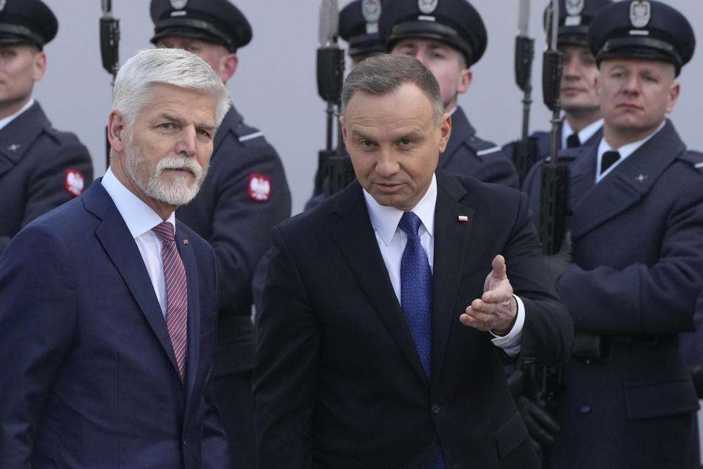 Polands President Andrzej Duda right welcomes Czech Republics President Petr Pavel as they meet at the Presidential Palace in Warsaw Poland Thursday March 16 2023.