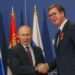 Russian President Vladimir Putin, left, shakes hands with Serbian President Aleksandar Vucic after being awarded the Order of Alexander Nevsky in Belgrade, Serbia, Thursday, Jan. 17, 2019.