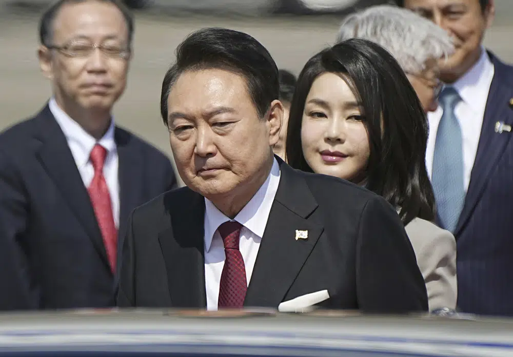 South Korean President Yoon Suk Yeol and his wife Kim Keon Hee arrive at Haneda International Airport in Tokyo Thursday March 16 2023.