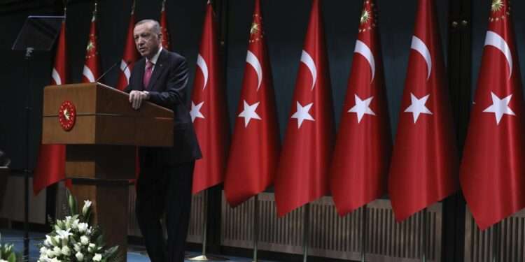 Turkey's President Recep Tayyip Erdogan speaks after he signed a decision confirming the election date, in Ankara, Turkey, Friday, March 10, 2023.