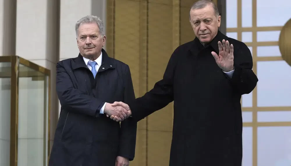 Turkish President, Recep Tayyip Erdogan, right, and Finland's President Sauli Niinisto shake hands during a welcome ceremony at the presidential palace in Ankara, Turkey, Friday, March 17, 2023.