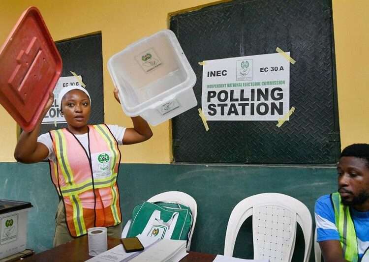 Nigerians Return To The Polls To Elect Governors 1 An electoral official displays an empty ballot box to party agents before voting begins at a polling station for a gubernatorial and House of Assembly candidate during local elections, in Lagos, on March 18, 2023.