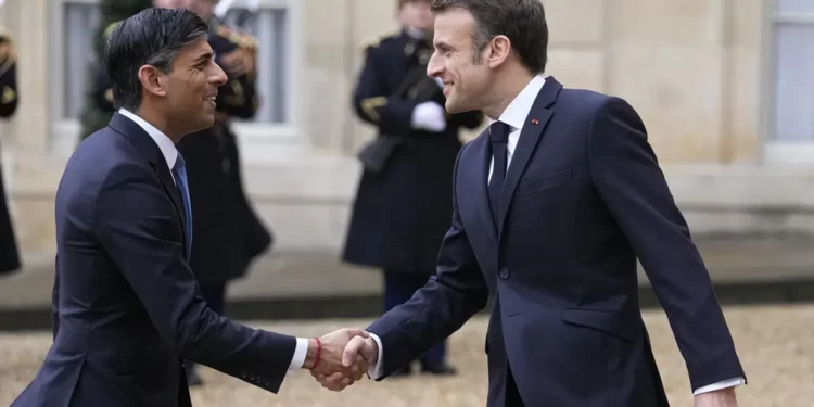 UK To Give France £500m To Help Curb Small Boat Crossings 1 French President Emmanuel Macron, right, shares hands with Britain's Prime Minister Rishi Sunak Friday, March 10, 2023 at the Elysee Palace in Paris.