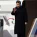 Xi waves to a crowd of reporters and dignitaries at the airport in Moscow
