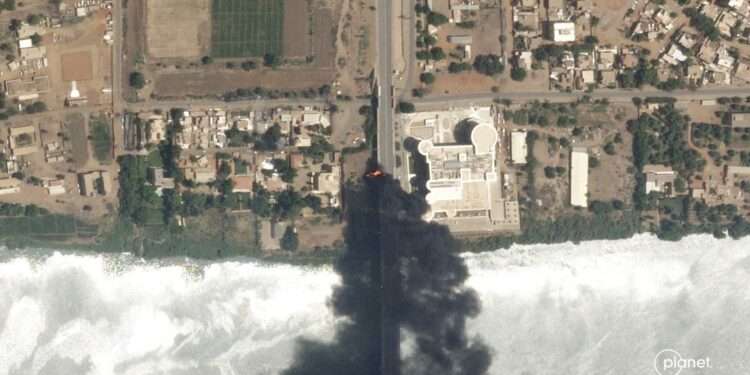 This satellite photo by Planet Labs PBC shows fires burning near a hospital in Khartoum, Sudan, Sunday April 16, 2023.