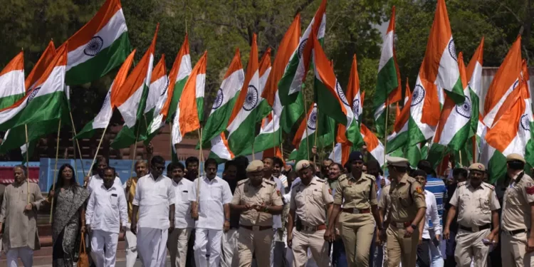 Indian Opposition Lawmakers Protest Against Modi Government 1 Opposition Lawmakers carry big national flag take out a protest march from Indian Parliament House, in New Delhi, India, Thursday, April 6, 2023.