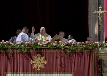 Pope Francis bestows the plenary 'Urbi et Orbi' (to the city and to the world) blessing from the central lodge of the St. Peter's Basilica at The Vatican at the end of the Easter Sunday mass, Sunday, April 9, 2023.