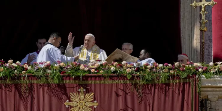Pope Francis bestows the plenary 'Urbi et Orbi' (to the city and to the world) blessing from the central lodge of the St. Peter's Basilica at The Vatican at the end of the Easter Sunday mass, Sunday, April 9, 2023.