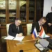 Hungary Signs New Energy Deal With Russia 13 In this handout photo released by Communications Department of Rosatom, Alexey Likhachev, Director General of State Atomiс Energy Corporation Rosatom, left, and Peter Szijjarto, Minister of Foreign Affairs and Trade of Hungary sign a document during their meeting in Moscow, Russia, Tuesday, April 11, 2023.