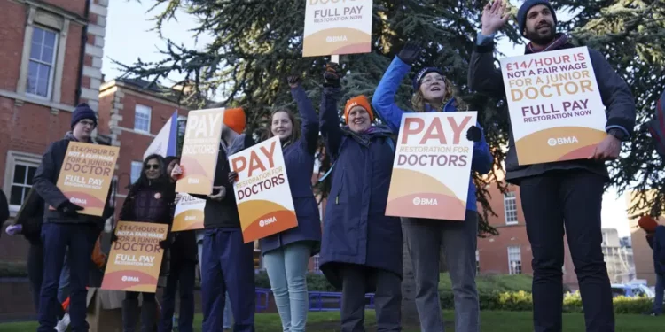Striking NHS junior doctors stand on the picket line outside Leicester Royal Infirmary as the BMA holds a 96-hour walkout in a dispute over pay, in Leicester, England, Tuesday April 11, 2023.