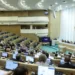 In this handout photo released by The Federal Assembly of The Russian Federation, members of the Federal Assembly of The Russian Federation attend a session in Moscow, Russia, Wednesday, April 12, 2023.