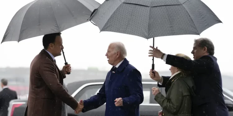 Biden Begins Ireland Trip After Speech At Belfast 1 President Joe Biden shakes hands with Ireland's Taoiseach Leo Varadkar, left,as his son Hunter Biden, right, and his sister Valerie Biden Owens, second from right, hold an umbrella for him at Dublin International Airport in Dublin, Ireland, Wednesday, April 12, 2023.