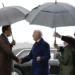 President Joe Biden shakes hands with Ireland's Taoiseach Leo Varadkar, left,as his son Hunter Biden, right, and his sister Valerie Biden Owens, second from right, hold an umbrella for him at Dublin International Airport in Dublin, Ireland, Wednesday, April 12, 2023.