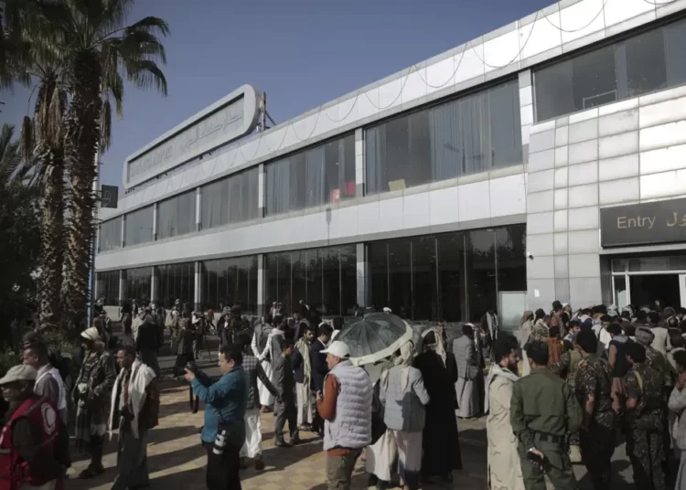 Yemen Rebels, Saudi Coalition Begin Major Prisoner Exchange 1 Yemeni gather at the airport ahead of a prisoners exchange in Sanaa, Yemen, Friday, April 14, 2023.