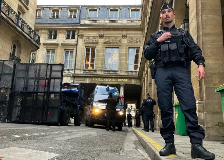 France’s Constitutional Council Approves Bill To Raise Retirement Age 1 Police forces set up a barricade in front of the Constitutional Council Friday, April 14, 2023 in Paris.
