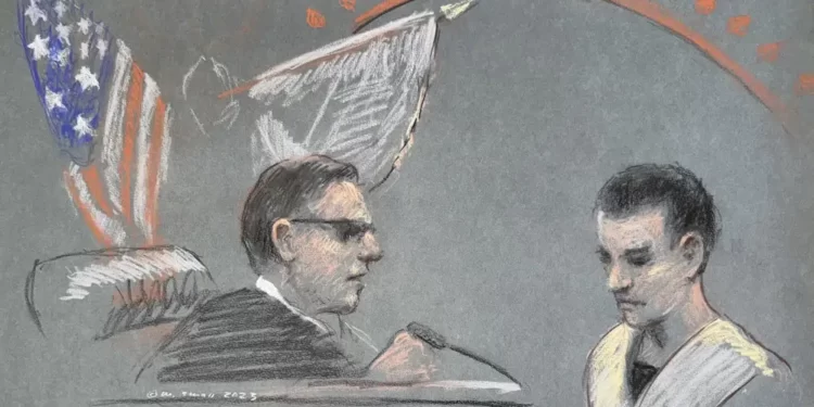 Massachusetts Air National Guardsman Jack Teixeira, right, appears in U.S. District Court in Boston, Friday, April 14, 2023.