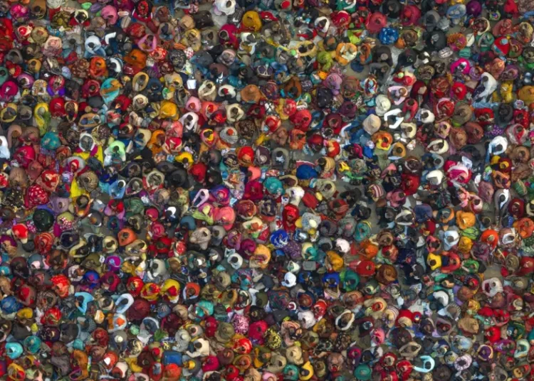 India To Have About 2.9 Million People More Than China By Mid-2023- UN 1 Hindu devotees listen to a religious leader at the Sangam, the confluence of the Ganges, Yamuna and mythical Saraswati rivers, during the annual traditional fair of Magh Mela festival, in Prayagraj, in the northern Indian state of Uttar Pradesh, Jan. 31, 2023.