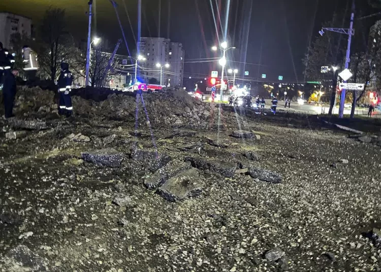 This handout photo released by Telegram Channel of Belgorod Region Governor Vyacheslav Gladkov shows the site of the crater after an explosion in Belgorod, Russia, Friday, April 21, 2023.