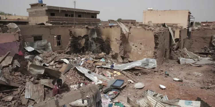<strong>One Step Forward, Ten Steps Backwards</strong> 1 A man walks by a house hit in recent fighting in Khartoum, Sudan, Tuesday, April 25, 2023.