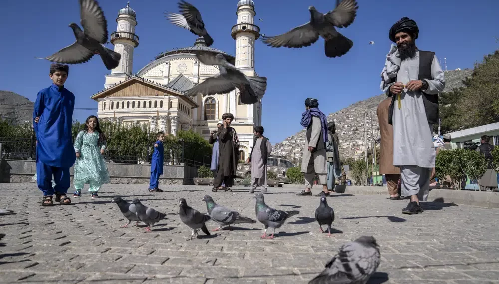 UN Urges Afghanistan’s Taliban To Reverse Restrictions On Women 1 Afghan people walk pass the Shah-Do Shamshira Mosque during the first day of Eid al-Fitr in Kabul, Afghanistan, Friday, April 21, 2023.