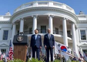 President Joe Biden and South Korea's President Yoon Suk Yeol stand as their two country's national anthems are played during a State Arrival Ceremony on the South Lawn of the White House in Washington.