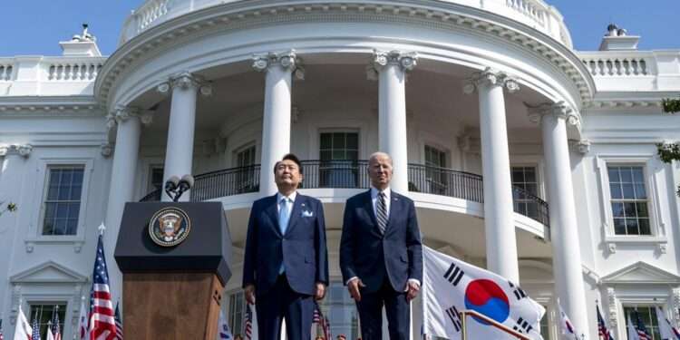 U.S, South Korea Unveil New Nuclear Deterrence Plan 1 President Joe Biden and South Korea's President Yoon Suk Yeol stand as their two country's national anthems are played during a State Arrival Ceremony on the South Lawn of the White House in Washington.