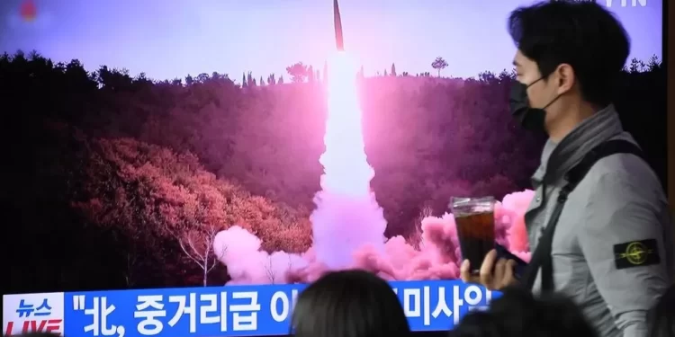 A TV screen is seen reporting North Korea's missile launch.
