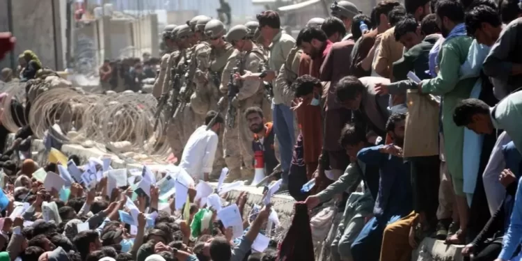 Afghanis gathered at the airport to join the evacuation plane ,during the U.S pull-out from Afghanistan in 2021