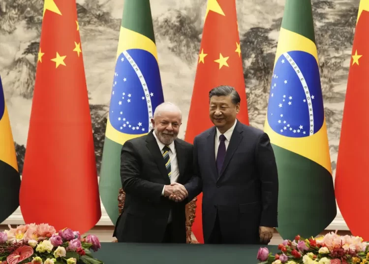 Brazilian President Luiz Inacio Lula da Silva, left, shakes hands with Chinese President Xi Jinping after a signing ceremony held at the Great Hall of the People in Beijing, China, Friday, April 14, 2023.