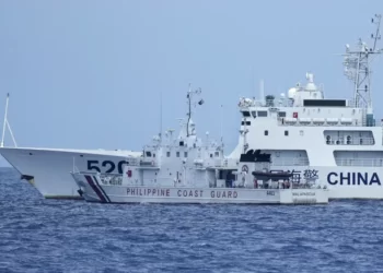 A Philippine Coast Guard Vessel and Chinese Ship, in a near-coalition.