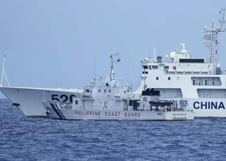 A Philippine Coast Guard Vessel and Chinese Ship, in a near-coalition.